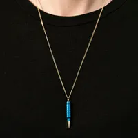 Pendentif Akillis chaîne cross Fatal Attraction en or jaune et aluminium bleu