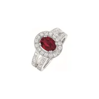 Bague solitaire Rubis sertie de diamants tailles baguette et brillant en or blanc palladié