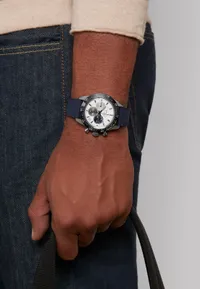 Montre CHRONOMASTER SPORT lunette céramique noire Bracelet caoutchouc et cordura bleu, Boucle déployante en acier, Cadran blanc avec 3 compteurs de couleurs