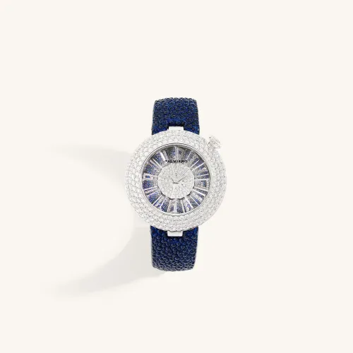 Montre Palmiero Alter en or blanc et saphirs bleus et diamants.