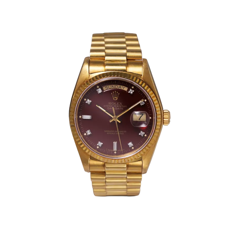 Oyster Perpetual Day-Date en or jaune 36mm, cadran Oxblood, lunette cannelée, bracelet President or jaune